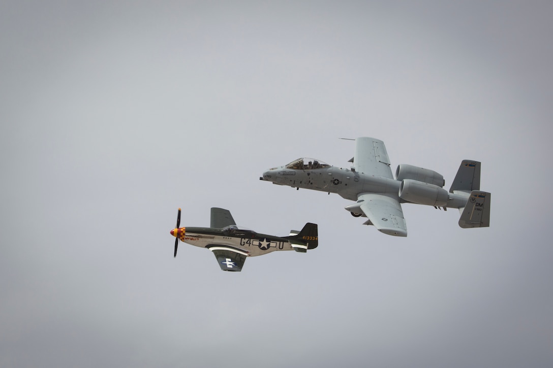 The U.S. Air Force A-10 Thunderbolt II and P-51D conduct a heritage flight during the 2019 Yuma Airhow hosted by Marine Corps Air Station (MCAS) Yuma Ariz., March 9, 2019. The airshow is MCAS Yuma's only military airshow of the year and provides the community an opportunity to see thrilling aerial and ground performers for free while interacting with Marines and Sailors. (U.S. Marine Corps photo by Sgt. Allison Lotz)