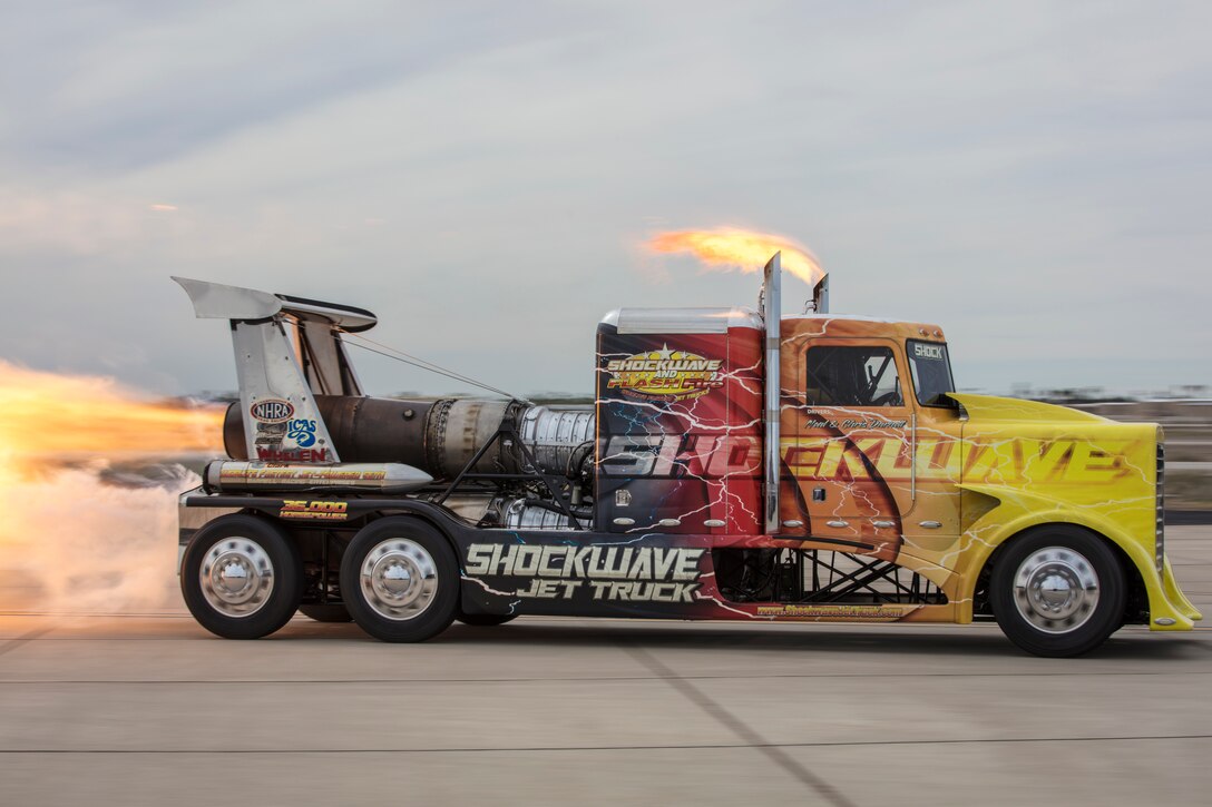 Chris Darnell, driver of the Shockwave Jet Truck, drives down the Marine Corps Air Station (MCAS) Yuma flight line during the 2019 Yuma Airhow hosted by Marine Corps Air Station (MCAS) Yuma Ariz., March 9, 2019. The airshow is MCAS Yuma's only military airshow of the year and provides the community an opportunity to see thrilling aerial and ground performers for free while interacting with Marines and Sailors. (U.S. Marine Corps photo by Sgt. Allison Lotz)