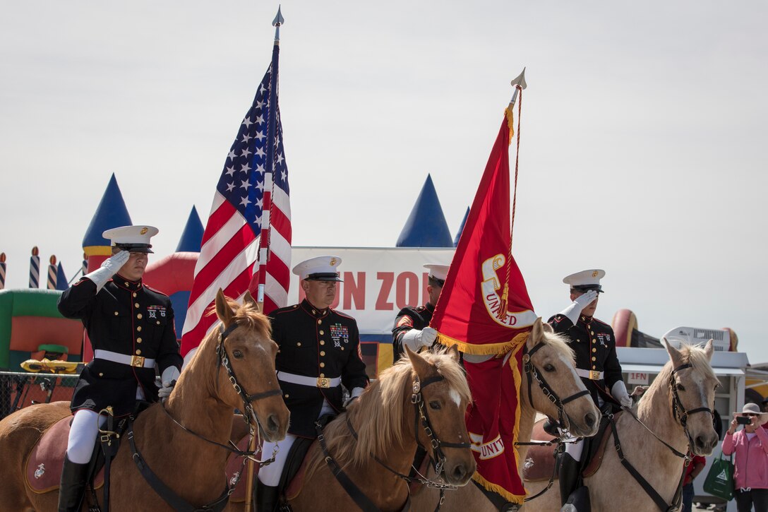 U.S. Marines assigned to the Mounted Color Guard, Marine Corps Base Barstow, Calif., participate in the opening ceremony at the 2019 Yuma Airhow hosted by Marine Corps Air Station (MCAS) Yuma Ariz., March 9, 2019. The airshow is MCAS Yuma's only military airshow of the year and provides the community an opportunity to see thrilling aerial and ground performers for free while interacting with Marines and Sailors. (U.S. Marine Corps photo by Sgt. Allison Lotz)