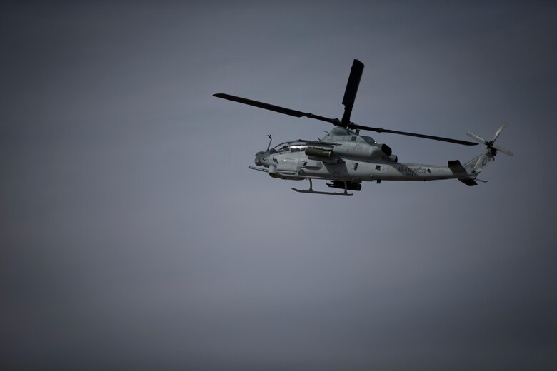 A Bell AH-1 Cobra conducts aerial displays during the 2019 Yuma Airshow at Marine Corps Air Station (MCAS) Yuma Ariz., March 9, 2019. The airshow is MCAS Yuma's only military airshow of the year and provides the community an opportunity to see thrilling aerial and ground performers for free while interacting with Marines and Sailors. (U.S. Marine Corps photo by Lance Cpl. Joel Soriano)