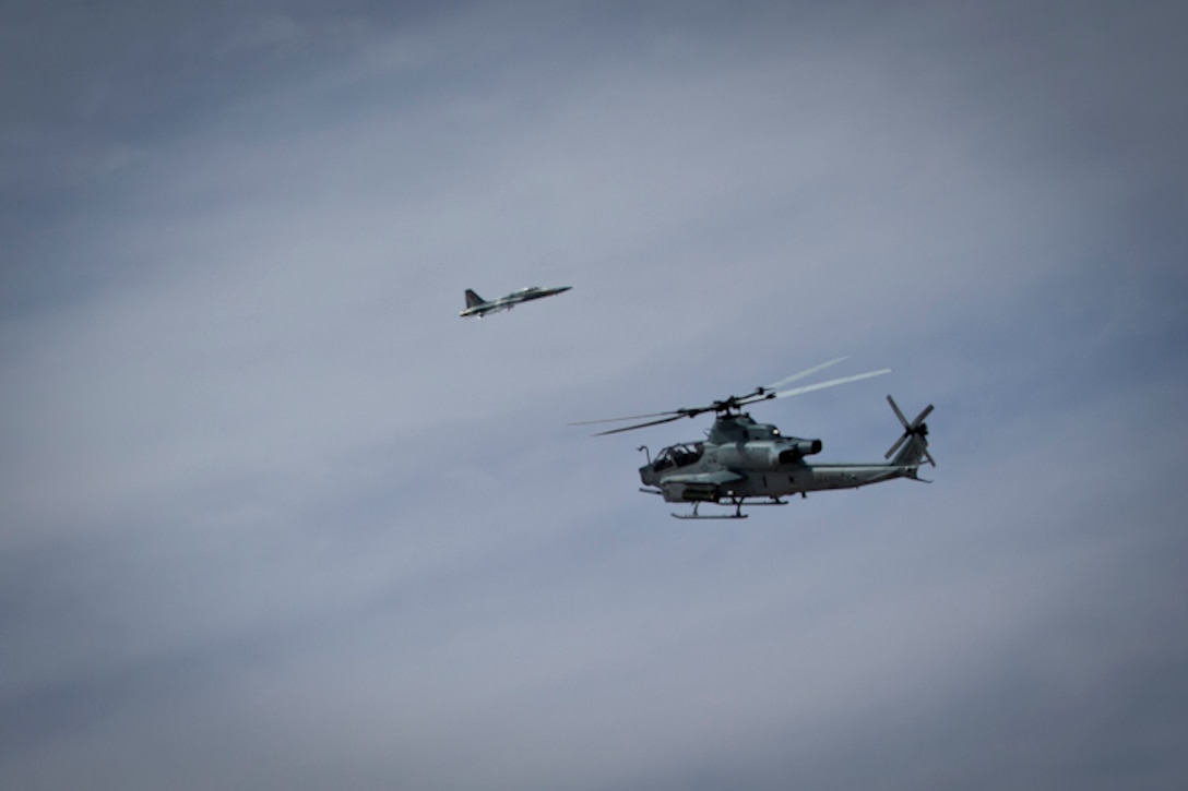 A Bell AH-1 Cobra conducts aerial displays during the 2019 Yuma Airshow at Marine Corps Air Station (MCAS) Yuma Ariz., March 9, 2019. The airshow is MCAS Yuma's only military airshow of the year and provides the community an opportunity to see thrilling aerial and ground performers for free while interacting with Marines and Sailors. (U.S. Marine Corps photo by Lance Cpl. Joel Soriano)