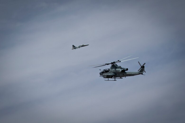 A Bell AH-1 Cobra conducts aerial displays during the 2019 Yuma Airshow at Marine Corps Air Station (MCAS) Yuma Ariz., March 9, 2019. The airshow is MCAS Yuma's only military airshow of the year and provides the community an opportunity to see thrilling aerial and ground performers for free while interacting with Marines and Sailors. (U.S. Marine Corps photo by Lance Cpl. Joel Soriano)