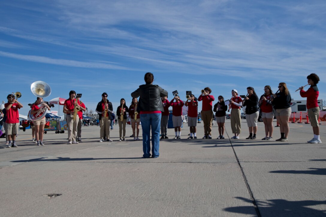 The Kofa High School Marching Band performs during the 2019 yuma Airshow hosted by Marine Corps Air Station (MCAS) Yuma Ariz., Saturday March 9, 2019. The airshow is MCAS Yuma's only military airshow of the year and provides the community an opportunity to see thrilling aerial and ground performers for free while interacting with Marines and Sailors. (U.S. Marine Corps photo by Lance Cpl. Joel Soriano)