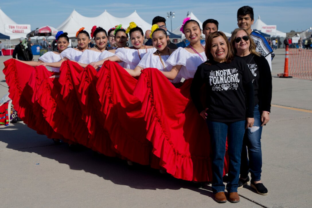 Students with Kofa Hisg School perform flkloric dances at the 2019 Yuma Airshow hosted by MArine Corps Air Station (MCAS) Yuma Ariz., Saturday, March 9, 2019. The airshow is MCAS Yuma's only military airshow of the year and provides the community an opportunity to see thrilling aerial and ground performers for free while interacting with Marines and Sailors. (U.S. Marine Corps photo by Lance Cpl. Joel Soriano)