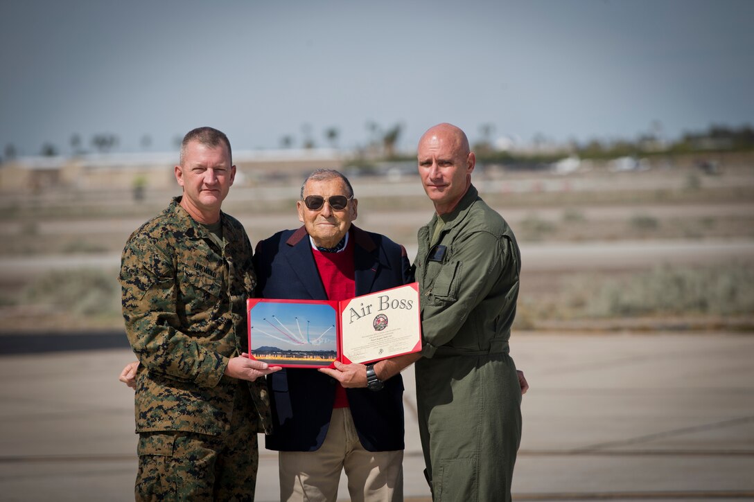 U.S. Marine Corps Col. David A. Suggs, Commanding Officer Marine Corps Air Station (MCAS) Yuma presents Jacques-Andre Istel "Mayor of Felicity", with the 2019 Yuma Airshow Honorary Air Boss award at MCAS Yuma Ariz., Saturday, March 9, 2019. The airshow is MCAS Yuma's only military airshow of the year and provides the community an opportunity to see thrilling aerial and ground performers for free while interacting with Marines and Sailors. (U.S. Marine Corps photo by Lance Cpl. Joel Soriano)