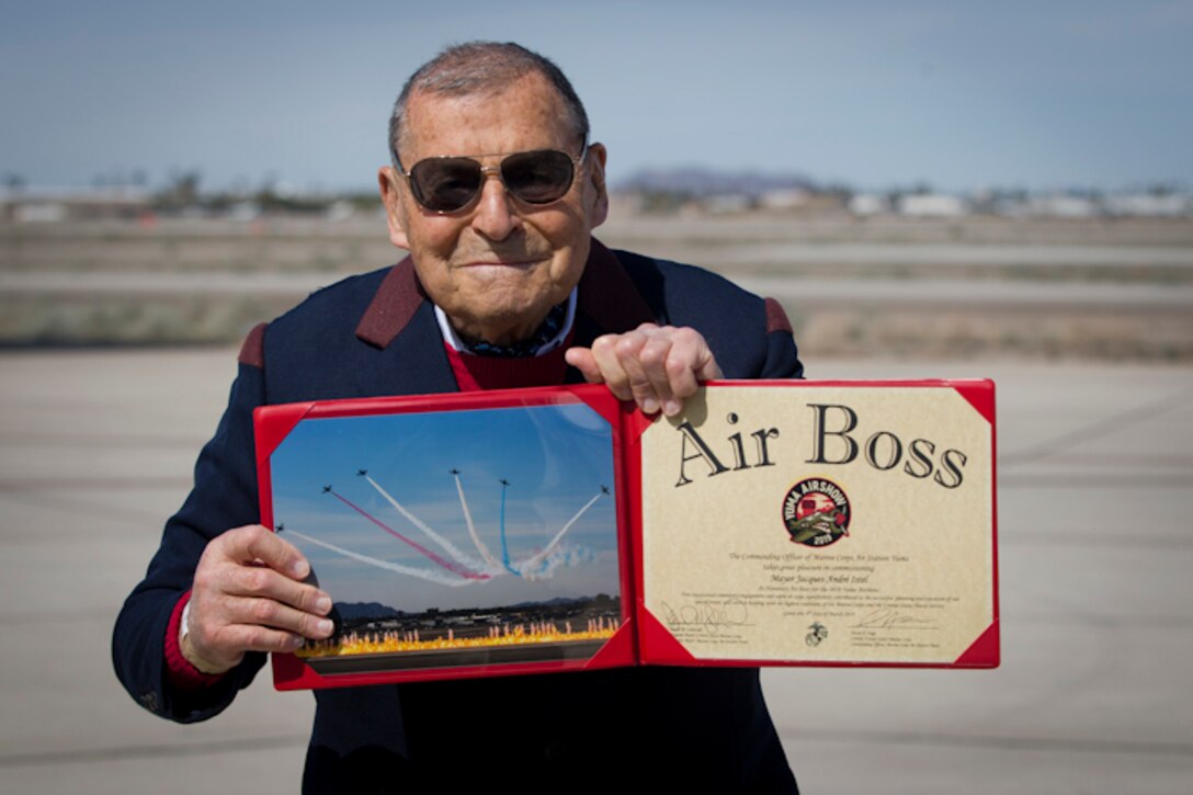 Jacques-Andre Istel "Mayor of Felicity" poses with the 2019 Yuma Airshow Honorary Air Boss award at MCAS Yuma Ariz., Saturday, March 9, 2019. The airshow is MCAS Yuma's only military airshow of the year and provides the community an opportunity to see thrilling aerial and ground performers for free while interacting with Marines and Sailors. (U.S. Marine Corps photo by Lance Cpl. Joel Soriano)
