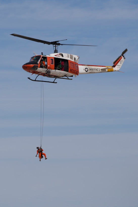 Marine Corps Air Station Yuma, Ariz., Search and Rescue HH-1N "Huey" displays their capabilities during the 2019 Yuma Airshow Saturday March 9, 2019. The "Huey" is used by the Marine Corps to provide all-weather, day or night, airborn command, control and coordination for assault support operations additionally, it is used for transportation and maritime special operations. The airshow is MCAS Yuma's only military airshow of the year and provides the community an opportunity to see thrilling aerial and ground performers for free while interacting with Marines and Sailors. (U.S. Marine Corps photo by Lance Cpl. Joel Soriano)