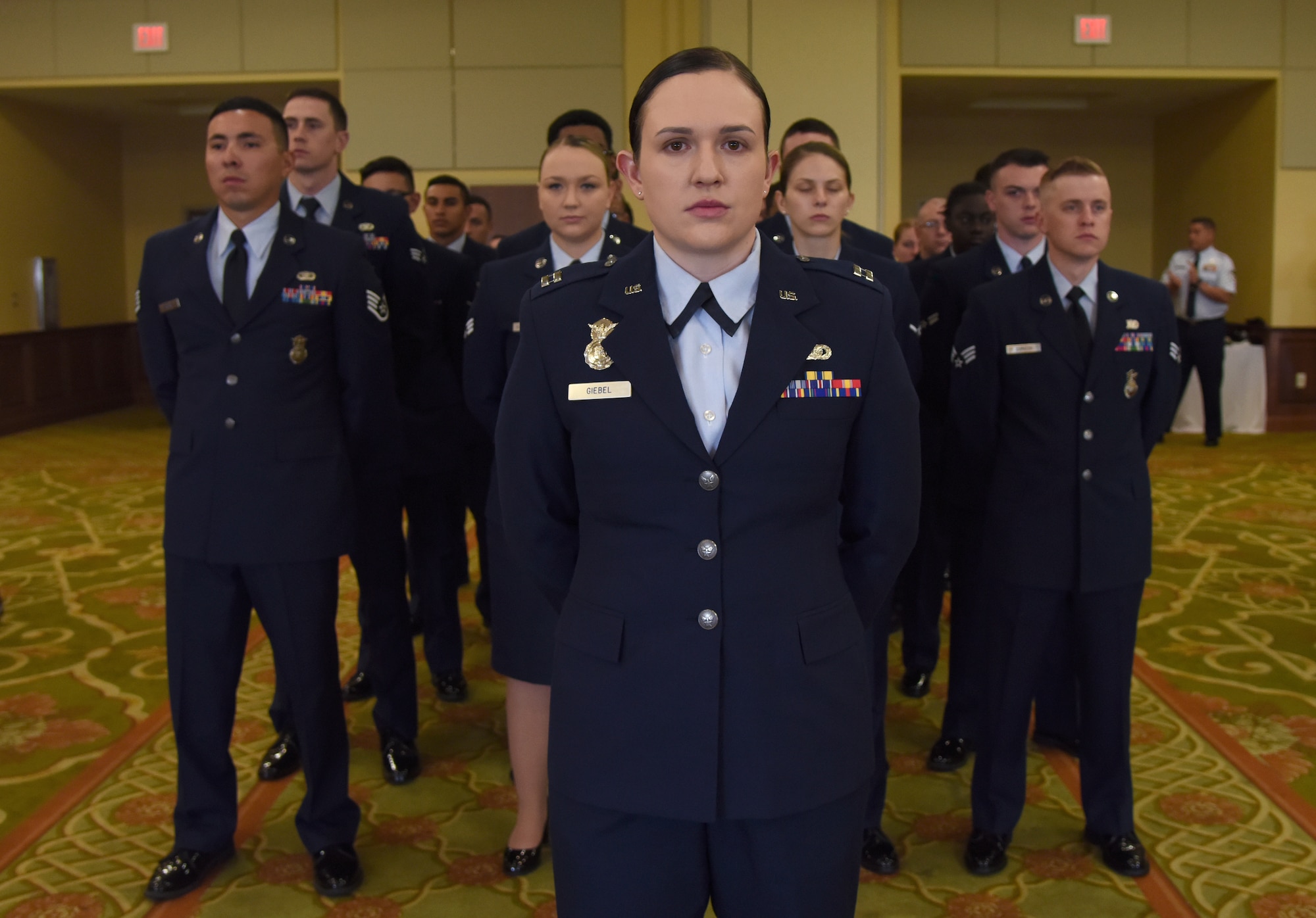 U.S. Air Force Capt. Samantha Giebel, 81st Security Forces Squadron operations officer, stands in formation during the 81st SFS change of command ceremony inside the Bay Breeze Event Center at Keesler Air Force Base, Mississippi, May 31, 2019. Maj. Matthew Lowe, incoming 81st SFS commander, assumed command from Lt. Col. Jonathon Murray, outgoing 81st SFS commander, with the passing of the guidon. The passing of the guidon is a ceremonial symbol of exchanging command from one commander to another. (U.S. Air Force photo by Kemberly Groue)