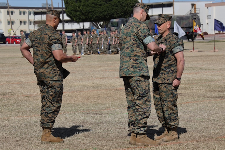 U.S. Marine Corps Sgt.Maj. William Bilenski is given an award during the Marine Air control Squadron 1 Relief and Appointment ceremony at Marine Corps Air Station Yuma, Ariz., March 13, 2019. The Relief and Appointment ceremony is an honored product of the rich heritage of Naval tradition. The heart of the ceremony is the passing of the organizational Non-Commissioned Officer (NCO) Sword by the Activity Commander from the outgoing Sergeant Major to the new Sergeant Major, which signifies the transfer of responsibility, accountability and authority, from one individual to another. (U.S. Marine Corps photo by Lance Cpl. Joel Soriano)