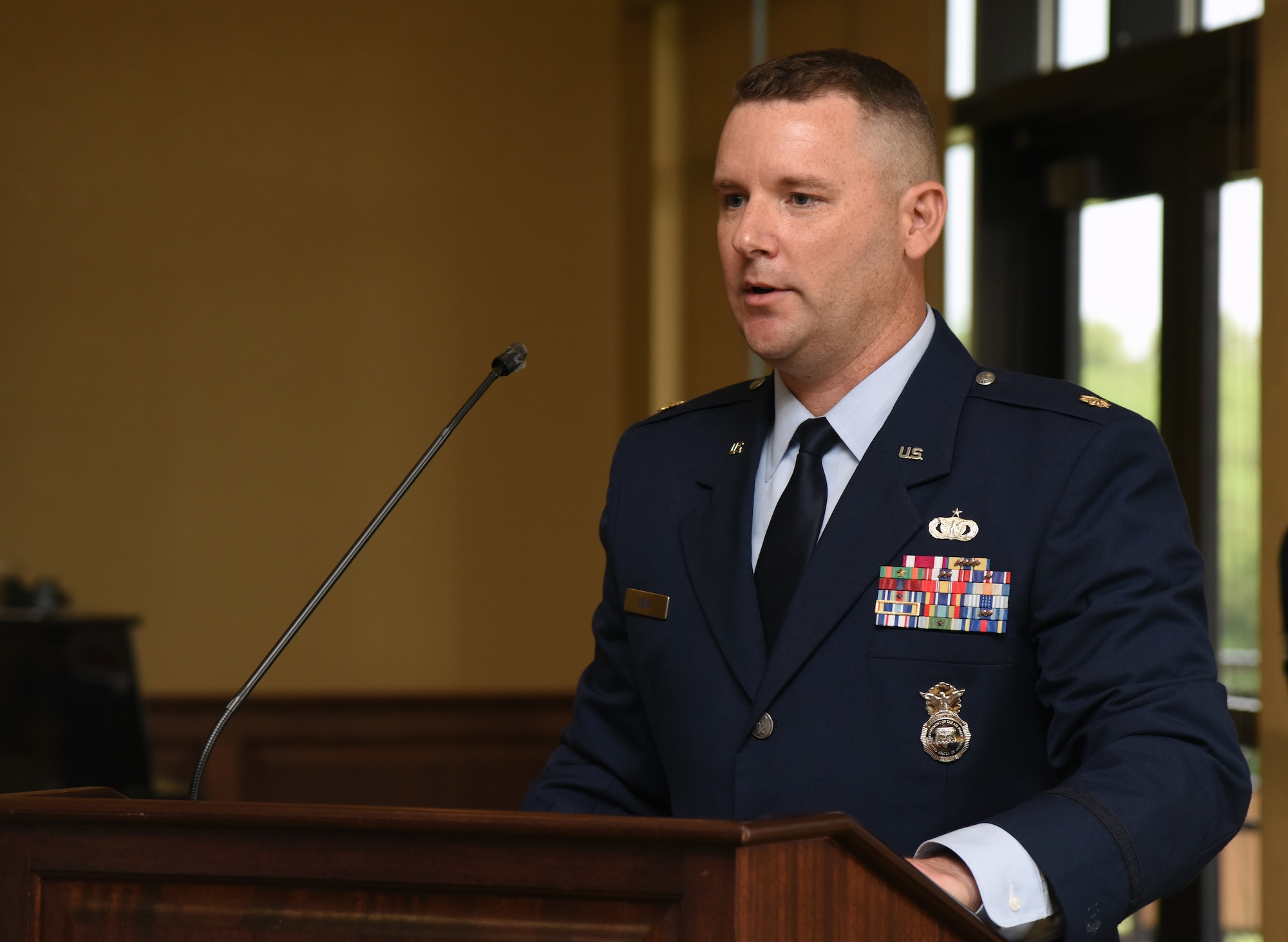U.S. Air Force Maj. Matthew Lowe, incoming 81st Security Forces Squadron commander, delivers remarks during the 81st SFS change of command ceremony inside the Bay Breeze Event Center at Keesler Air Force Base, Mississippi, May 31, 2019. Prior to becoming the 81st SFS commander, Lowe was the Officer Training School Deputy Chief of Standards and Evaluation, at Maxwell Air Force Base, Alabama. (U.S. Air Force photo by Kemberly Groue)