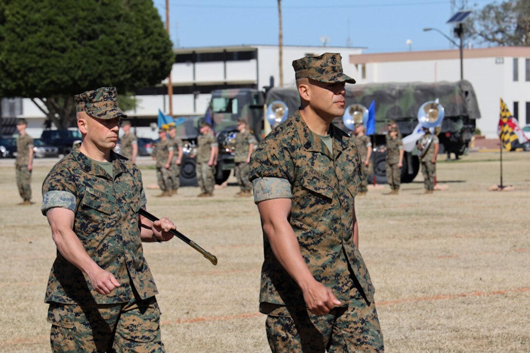 U.S. Marine Corps Sgt. Maj. William Bilenski (Left) and Sgt. Maj. George Hernandez (Right) prepare to exchange the Non-Commissioned Officer (NCO) Sword during the Marine Air Control Squadron 1 Relief and Appointment ceremony at Marine Corps Air Station Yuma, Ariz., March 13, 2019. The Relief and Appointment ceremony is an honored product of the rich heritage of Naval tradition. The heart of the ceremony is the passing of the organizational Non-Commissioned Officer (NCO) Sword by the Activity Commander from the outgoing Sergeant Major to the new Sergeant Major, which signifies the transfer of responsibility, accountability and authority, from one individual to another. (U.S. Marine Corps photo by Lance Cpl. Joel Soriano)