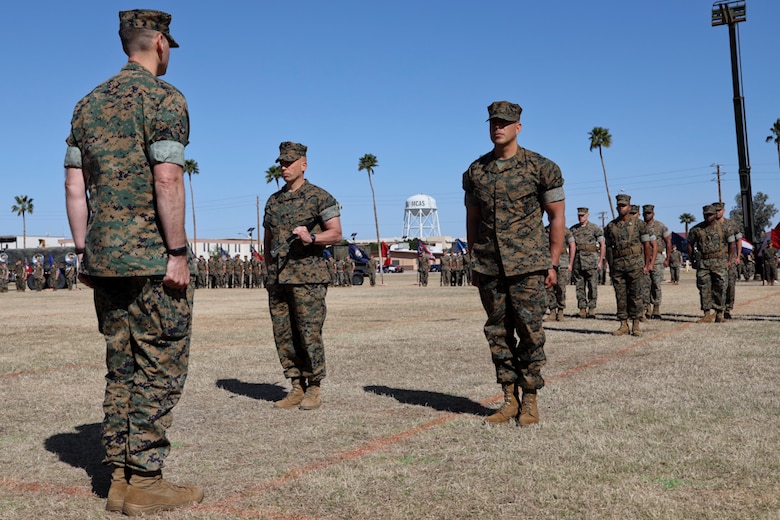 U.S. Marine Corps Sgt. Maj. William Bilenski (Left) and Sgt. Maj. George Hernandez (Right) prepare to exchange the Non-commissioned officer (NCO)  Sword during the Marine Air Control Squadron 1 Relief and Appointment ceremony at Marine Corps Air Station Yuma, Ariz,. March. 13, 2019. The Relief and Appointment ceremony is an honored product of the rich heritage of Naval tradition. The heart of the ceremony is the passing of the organizational Non-commissioned (NCO) Sword by the Activity Commander from the outgoing Sergeant Major to the new Sergeant Major, which signifies the transfer of responsibility, accountability and authority, from one individual to another. (U.S. Marine Corps photo by Lance Cpl. Joel Soriano)