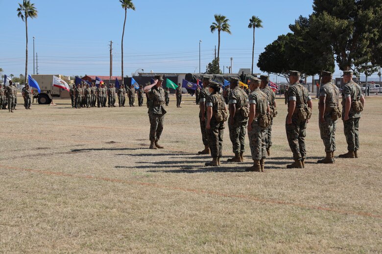 U.S. Marines participate in the Marine Air Control Squadron 1 Relief and Appointment ceremony at Marine Corps Air Station Yuma, Ariz,. March. 13, 2019. The Relief and Appointment ceremony is an honored product of the rich heritage of Naval tradition. The heart of the ceremony is the passing of the organizational NCO Sword by the Activity Commander from the outgoing Sergeant Major to the new Sergeant Major, which signifies the transfer of responsibility, accountability and authority, from one individual to another. (U.S. Marine Corps photo by Lance Cpl. Joel Soriano)