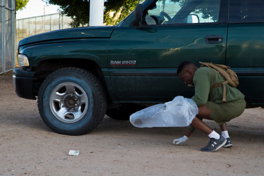 U.S. Marines with Headquaters and Headquarters Squadron(H&HS) conduct a base wide clean up at Marine Corps Air Station(MCAS) Yuma, Ariz., March 15, 2019. The base clean up is intended to boost unit morale and ensure the cleanliness of MCAS Yuma. (U.S. Marine Corps photo by Pfc John Hall)