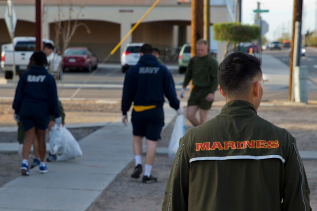 U.S. Marines with Headquaters and Headquarters Squadron(H&HS) conduct a base wide clean up at Marine Corps Air Station(MCAS) Yuma, Ariz., March 15, 2019. The base clean up is intended to boost unit morale and ensure the cleanliness of MCAS Yuma. (U.S. Marine Corps photo by Pfc John Hall)