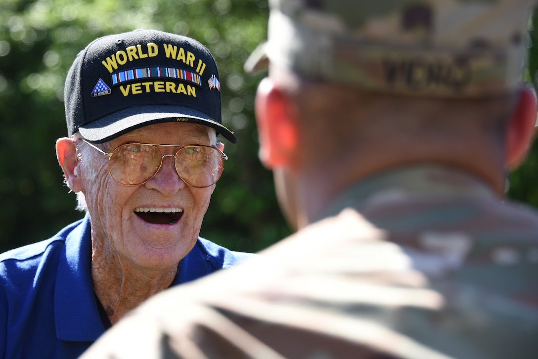 A veteran talks with a soldier.