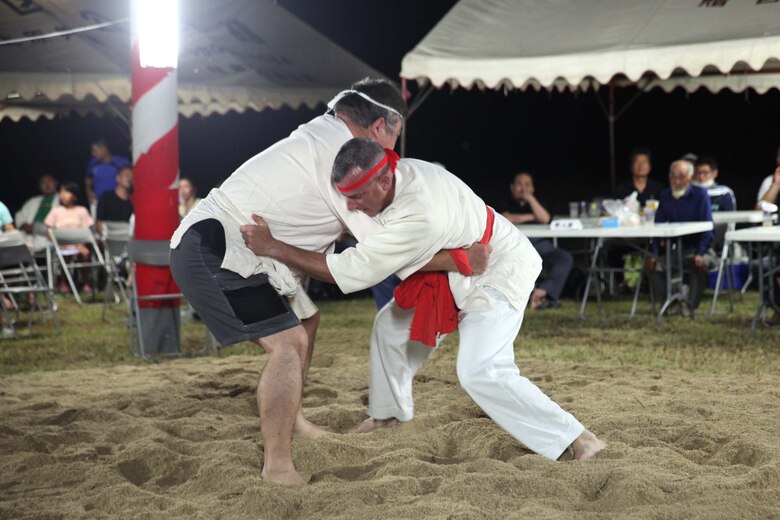 Col. Jason S.D. Perry, Camp Schwab Commanding officer, participates in Okinawan unique sumo wrestling competition for first time ever June 1, 2019. The Henoko sumo competition is a century-old traditional event which has included Marines from Camp Schwab since 1973.