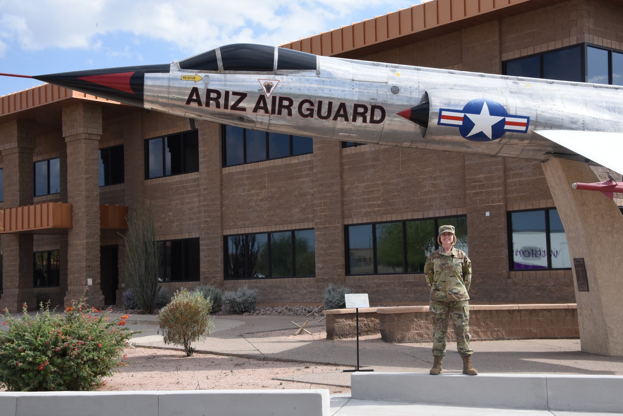 Chief Master Sgt. Rachel Landegent, 161st Air Refueling Wing mission support group superintendent, poses in front of a static display at her duty station June 2, 2019. Landegent is the 2019 Air National Guard First Sergeant of the Year, never faltering in her duty-bound mission to inspire Airman to rise beyond limits. (U.S. Air National Guard photo by 1st Lt. Tinashe Machona)