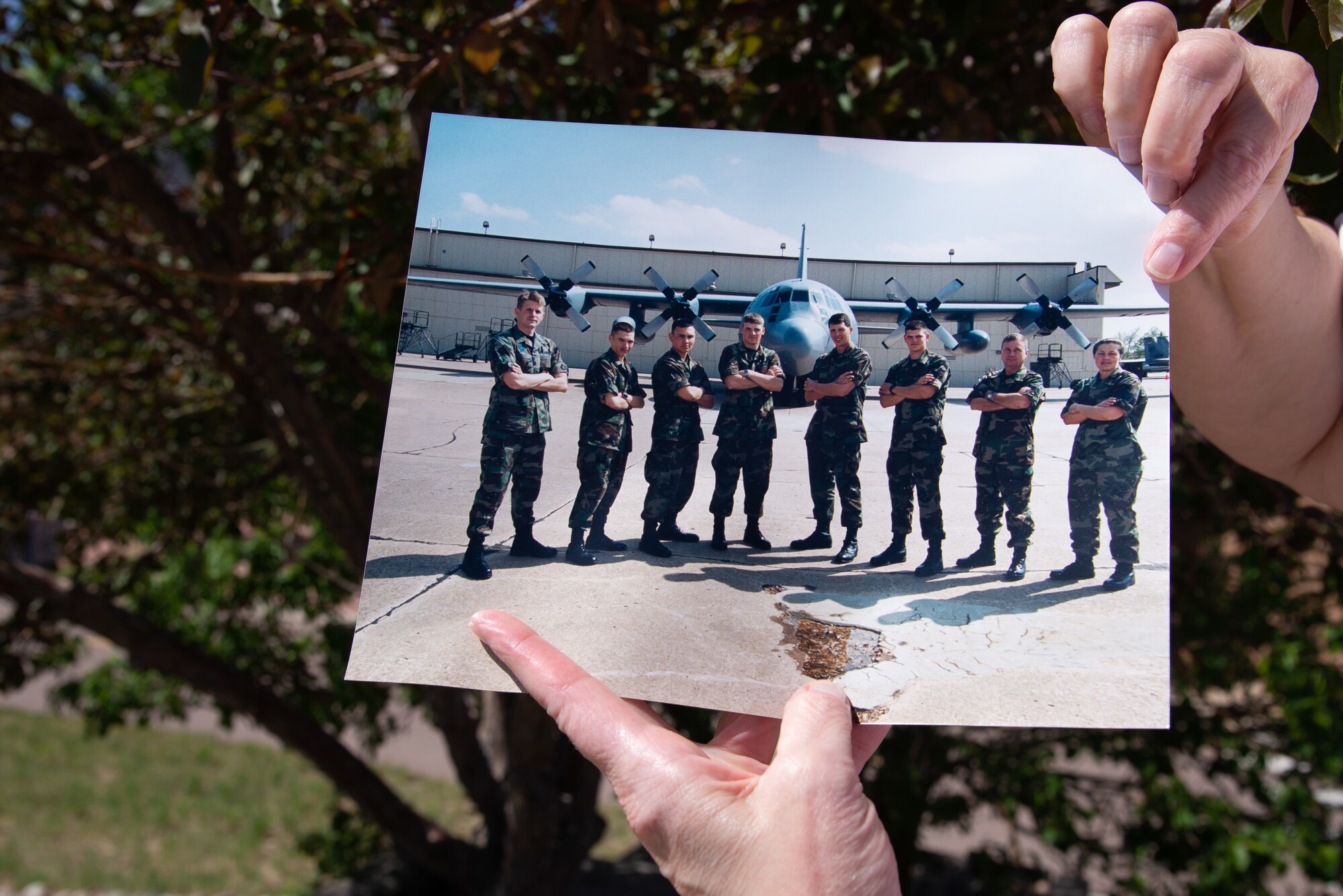 Tech. Sgt. Tanya Keller, a 302nd Maintenance Group Plans, Scheduling and Documentation production controller, holds an old photograph June 1, 2019 at Peterson Air Force Base, Colorado