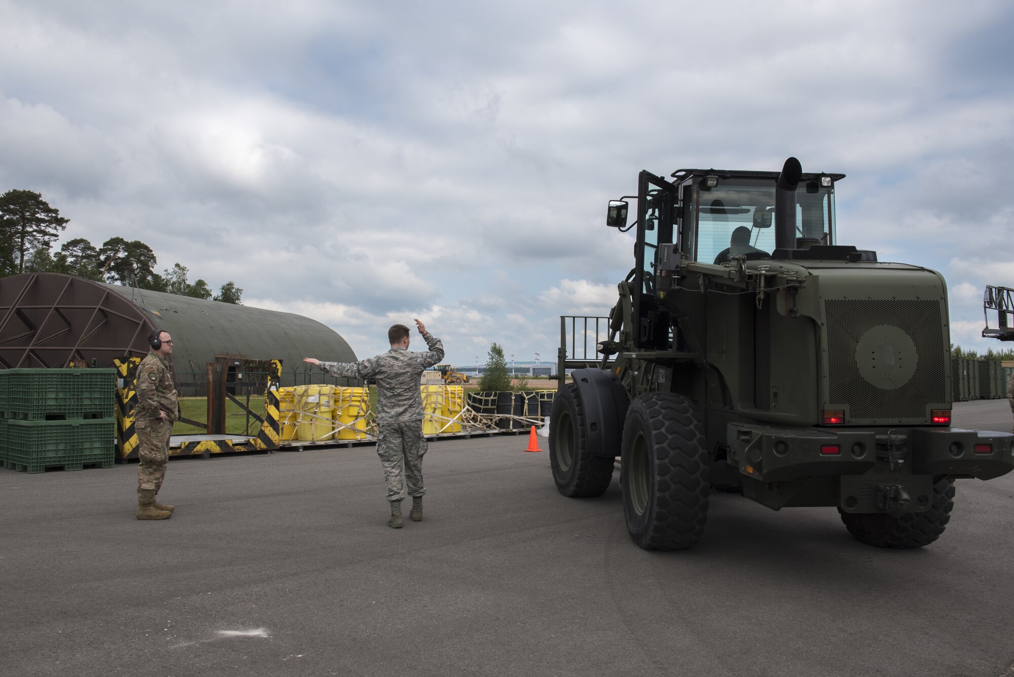 U.S. Airmen participating in the Landing Zone Safety Officer course learn how to drive a 10K forklift and also give proper signals to navigate the vehicle on Ramstein Air Base, Germany, May 29, 2019. Having hybrid Airmen who are certified allows for a smaller carbon footprint. (U.S. Air Force Photo by Airman 1st Class Kaylea Berry)