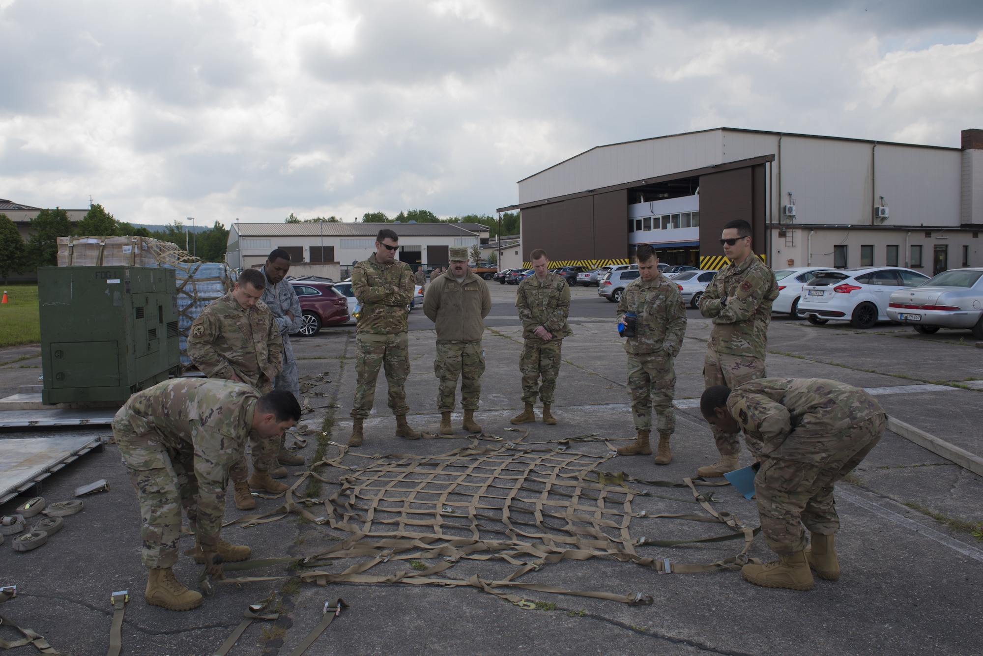 Students participating in the Landing Zone Safety Officers course learn how to properly secure a pallet on Ramstein Air Base, Germany, May 23, 2019. This allows them to further their skills and be used in other career fields. (U.S. Air Force Photo by Airman 1st Class Kaylea Berry)