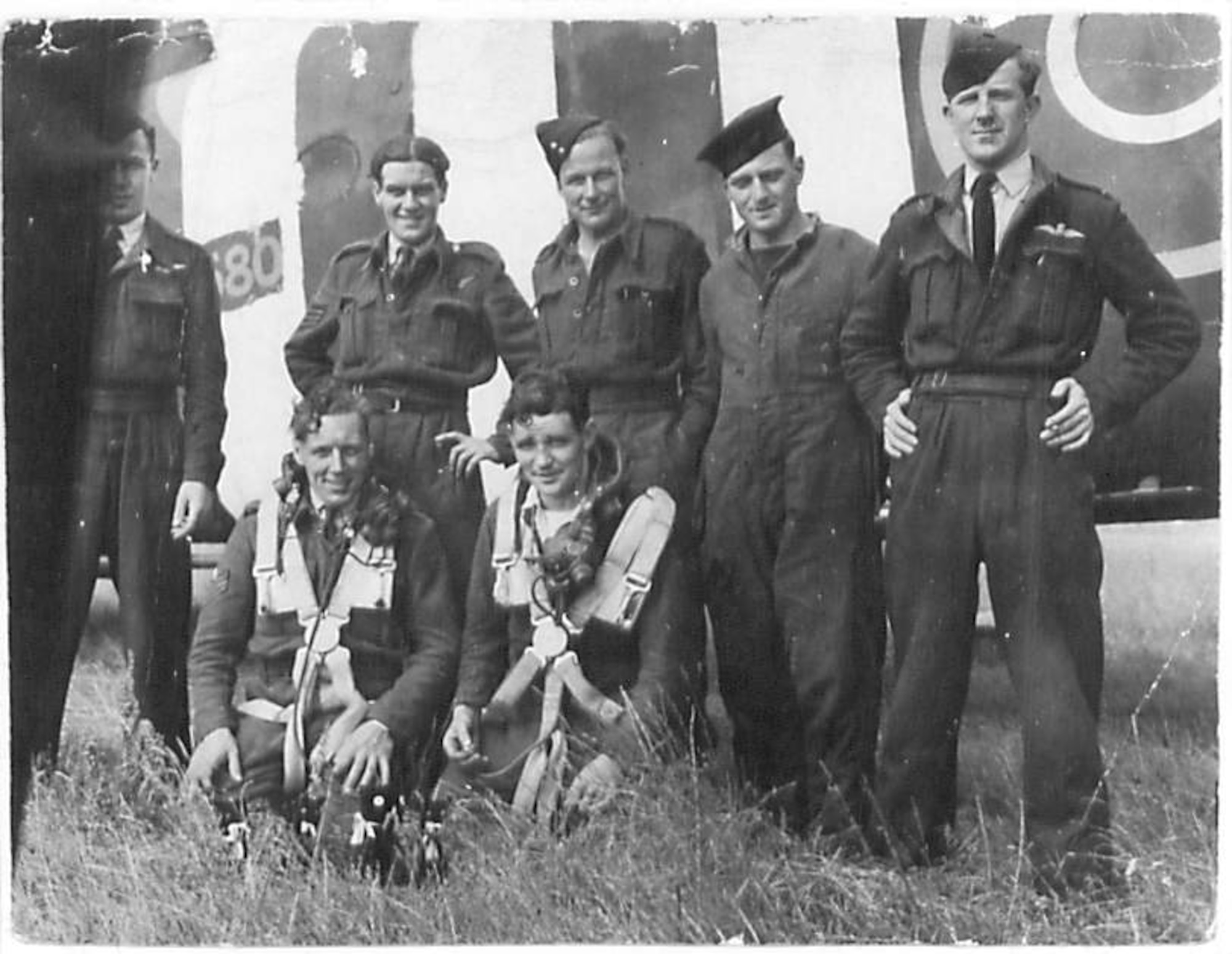 Airmen from the 620th Squadron stand under their aircraft at RAF Fairford, England, Sept. 9, 1944. The crew was at Fairford to gain experence on radial engines. (Courtesy photo)