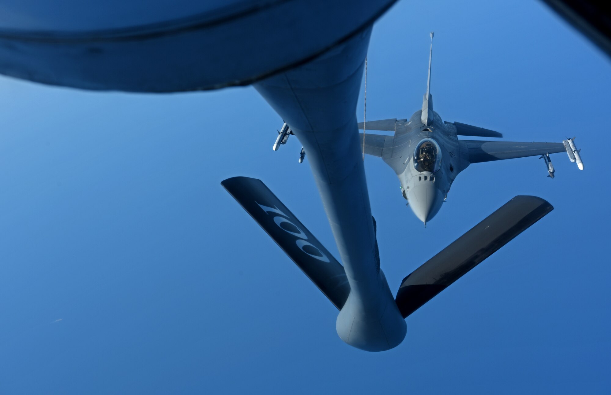 A U.S. Air Force F-16 Fighting Falcon from the 457th Fighter Squadron, Fort Worth, TX, prepares to receive fuel from a 100th Air Refueling Wing KC-135 Stratotanker from RAF Mildenhall, England, during exercise Astral Knight over the skies of Italy, June 3, 2019. AK19 is a joint, multinational exercise which aims to demonstrate the integration, coordination, and interoperability of joint existing command and control at the operation and tactical levels. (U.S. Air Force photo by Airman 1st Class Brandon Esau)