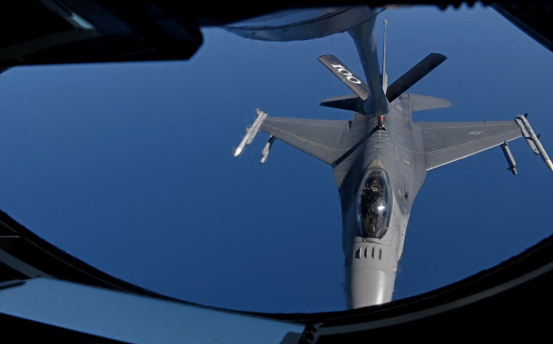 A U.S. Air Force F-16 Fighting Falcon from the 457th Fighter Squadron, Fort Worth, TX,  prepares to receive fuel from a 100th Air Refueling Wing KC-135 Stratotanker from RAF Mildenhall, England, during exercise Astral Knight over the skies of Italy, June 3, 2019. AK19 is a joint, multinational exercise which aims to demonstrate the integration, coordination, and interoperability of joint existing command and control at the operation and tactical levels. (U.S. Air Force photo by Airman 1st Class Brandon Esau)