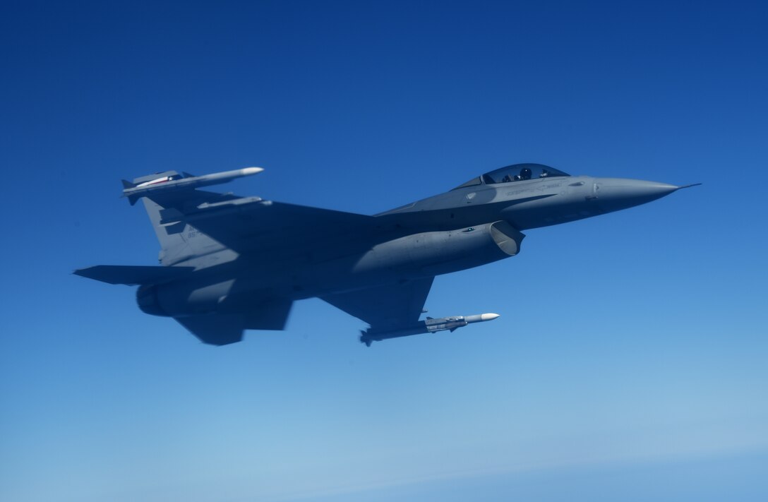 A U.S. Air Force F-16 Fighting Falcon from the 457th Fighter Squadron, Fort Worth, Texas,  performs aerial maneuvers alongside a 100th Air Refueling Wing KC-135 Stratotanker from RAF Mildenhall, England, during exercise Astral Knight over the skies of Italy, June 3, 2019. AK19 is a joint, multinational exercise designed to test Integrated Air and Missile Defense capabilities and will involve a combination of flight operations and computer-assisted exercise scenarios. Participants include the U.S. Air Forces in Europe, U.S. Army Europe forces, and members from the Italian and Croatian air forces. (U.S. Air Force photo by Airman 1st Class Brandon Esau)