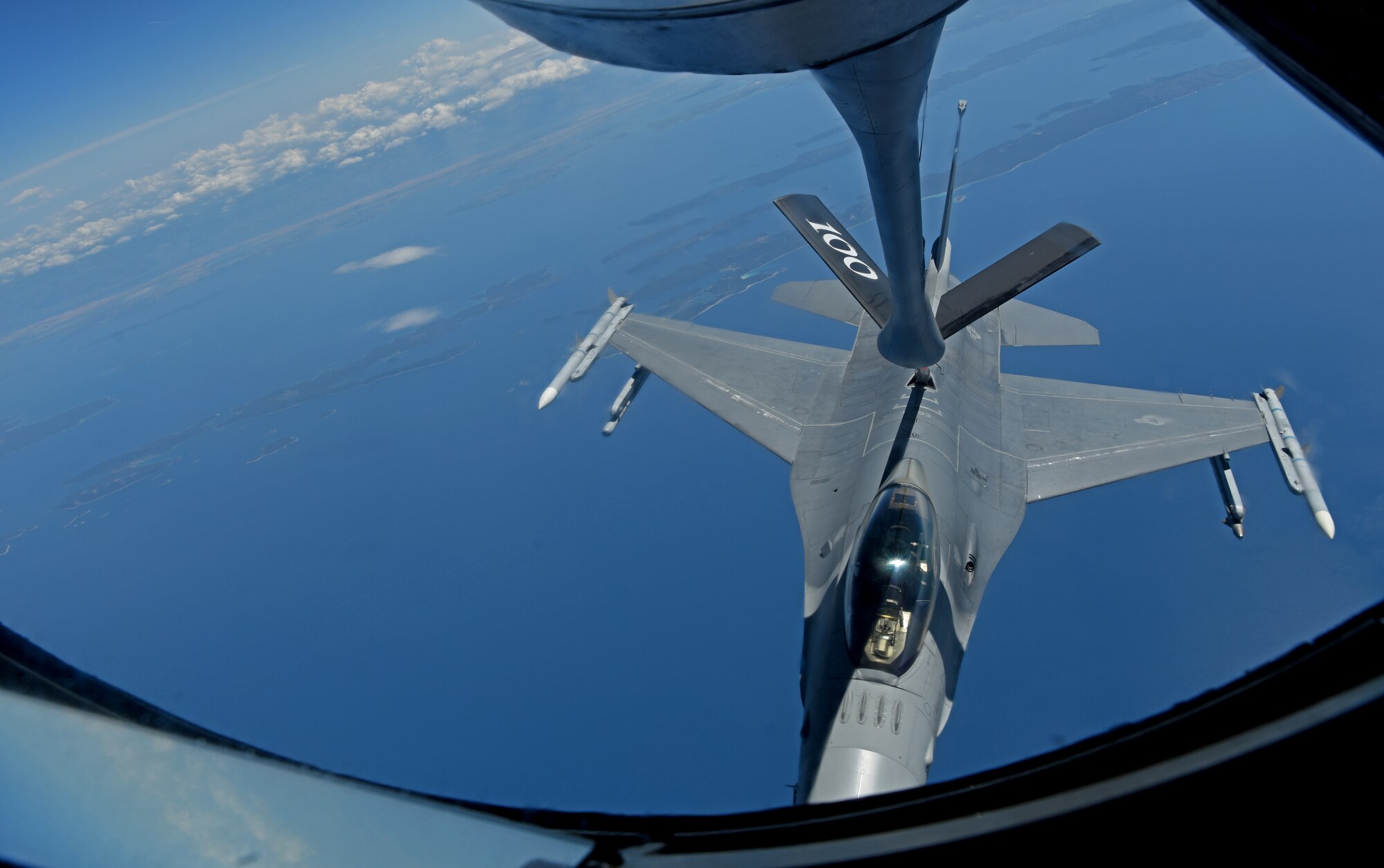 A U.S. Air Force F-16 Fighting Falcon from the 457th Fighter Squadron, Fort Worth, TX, receives fuel from a 100th Air Refueling Wing KC-135 Stratotanker from RAF Mildenhall, England, during exercise Astral Knight over the skies of Italy, June 3, 2019. AK19 is a joint, multinational exercise which aims to demonstrate the integration, coordination, and interoperability of joint existing command and control at the operation and tactical levels. (U.S. Air Force photo by Airman 1st Class Brandon Esau)