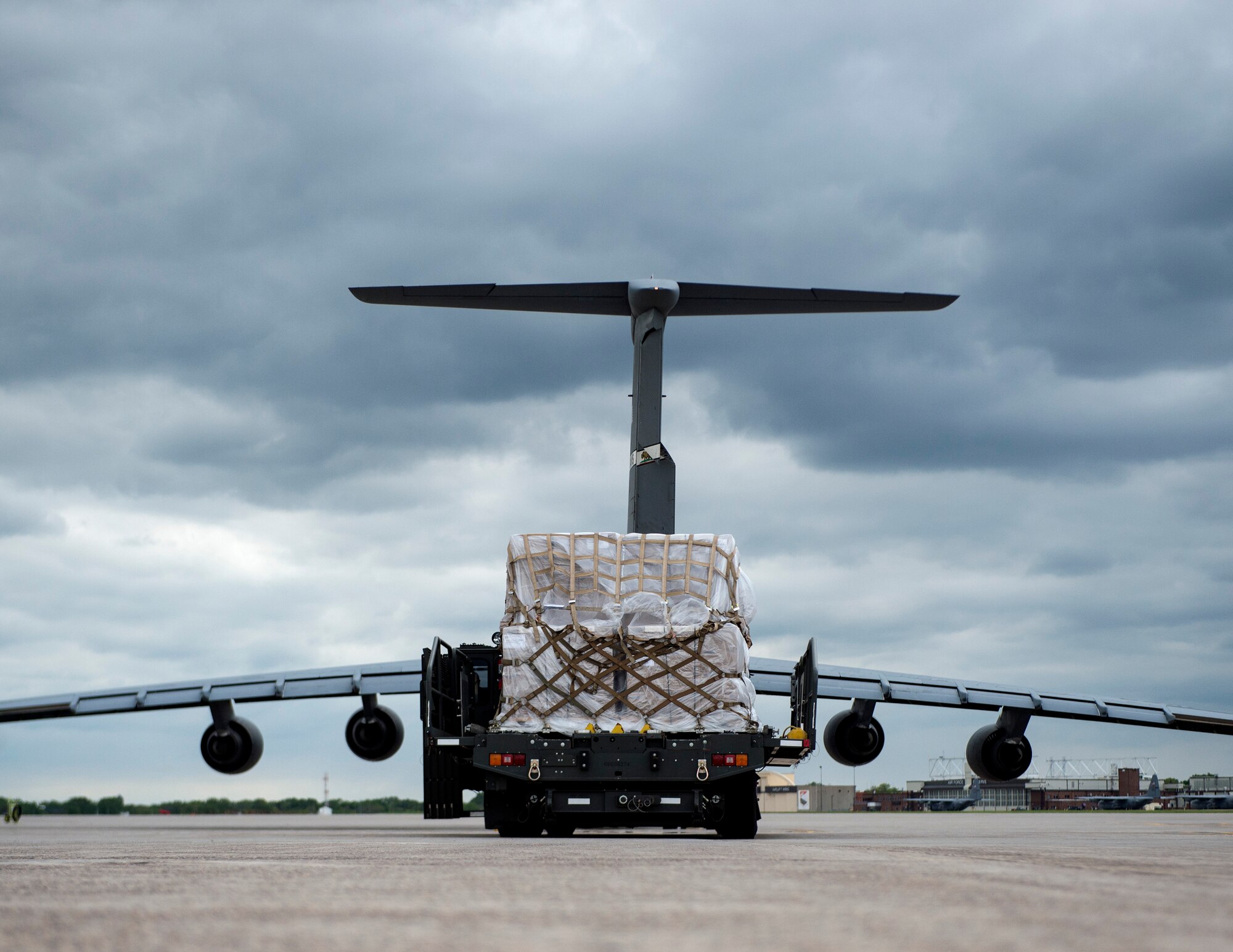 A 60K Loader from the 133rd Small Air Terminal waits to off load the cargo onto a C-5 Galaxy in St. Paul, Minn., May 22, 2019.
