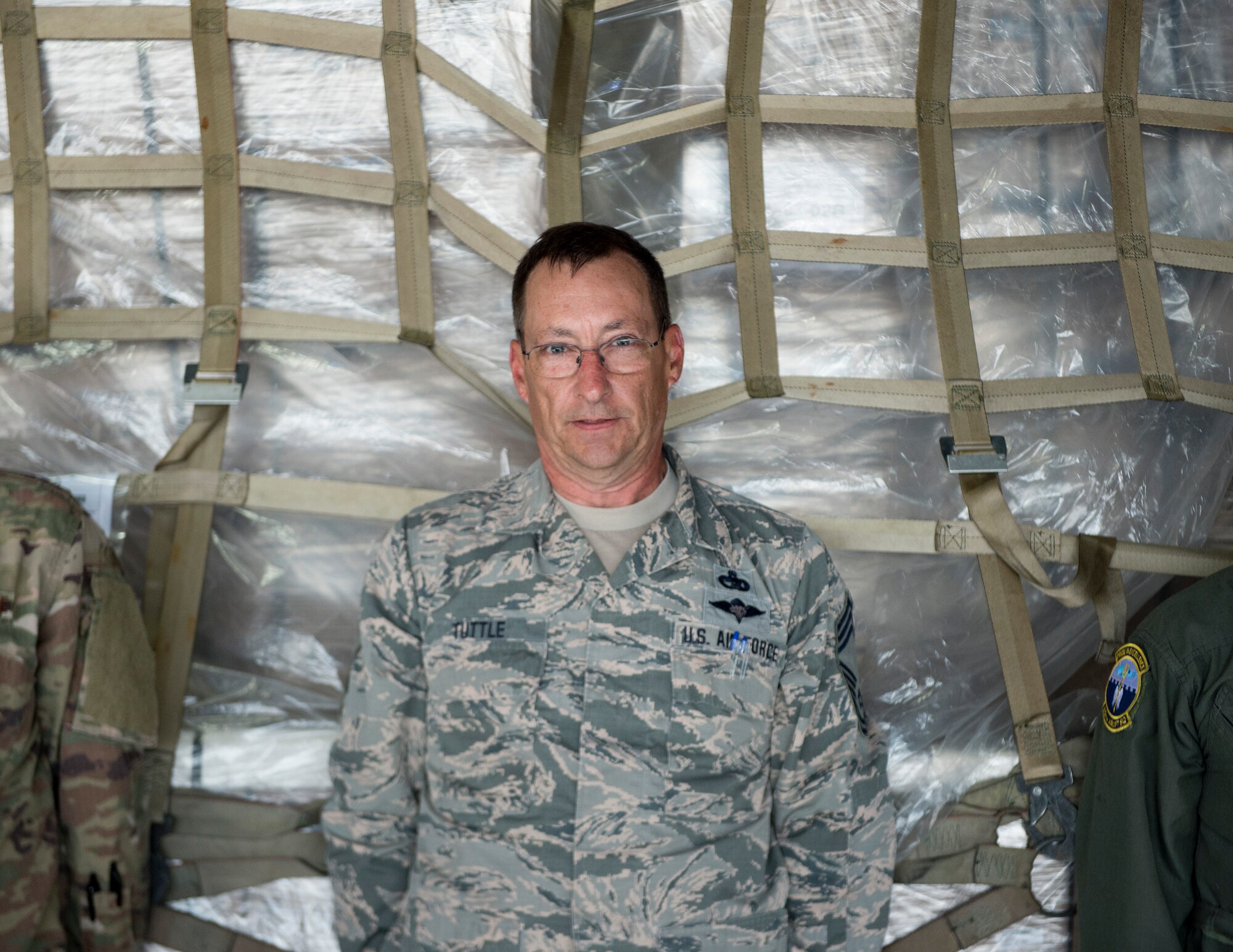 U.S. Air Force Chief Master Sgt. Steve Tuttle, 133rd Small Air Terminal, pushes a pallet onto the C-5 Galaxy in St. Paul, Minn., May 22, 2019.