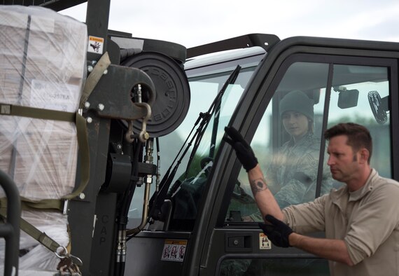 U.S. Air Force Senior Airman Megan Lenling, 133rd Small Air Terminal, watches the hand and arm signals from Master Sgt. Neil Bacon in St. Paul, Minn., May 22, 2019.