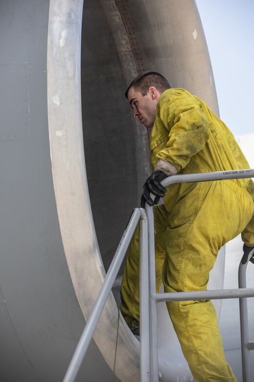 Staff Sgt. Matthew Card, 445th Maintenance Squadron, inspects the inlet of an engine on a C-17 Globemaster III here, May 5, 2019.  (U.S. Air Force photo /Master Sgt. Patrick O’Reilly)