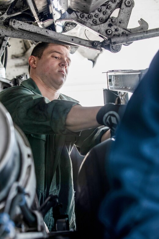 Staff Sgt. Brian Wylie, 445th Aircraft Maintenance Squadron, works on a C-17 Globemaster III tire during the May 5, 2019 unit training assembly.  (U.S. Air Force photo /Master Sgt. Patrick O’Reilly)