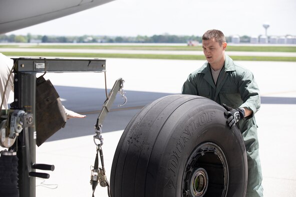 Staff Sgt. Brian Wylie, 445th Aircraft Maintenance Squadron, replaces a tire on a C-17 Globemaster III here, May 5, 2019.  (U.S. Air Force photo /Master Sgt. Patrick O’Reilly