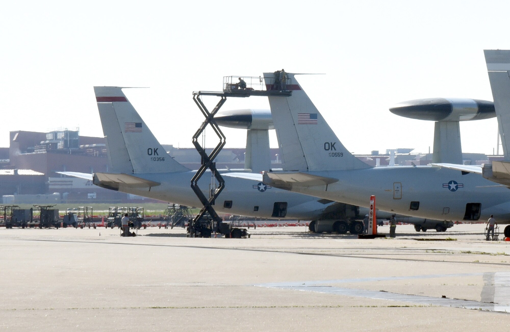 An aircraft lift is used by members of the 552nd Maintenance Squadron to perform repairs on the tail of an E-3 Sentry. The Aerospace Ground Equipment (AGE) Shop maintains and provided the necessary ground equipment to help maintain the aircraft when not in flight. (U.S. Air Force photo/Kelly White)