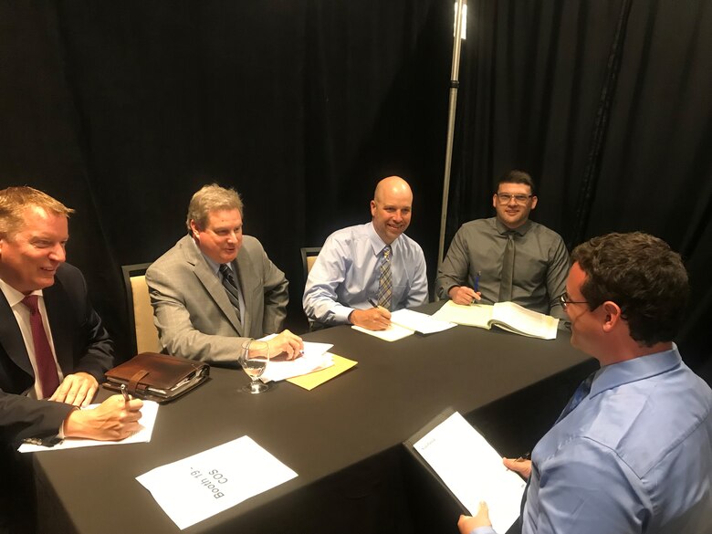 Left to right, David McCain, Patrick Dolan, Health Morton and Jacob Miracle, interviews potential candidate Sean Patrick at the AFLCMC hiring event on May 29 at the Marriot Hotel in downtown Dayton, Ohio. Patrick is currently a contractor at AFLCMC/HI, and is seeking employment in cyber security. (U.S. Air Force photo/Stacey Geiger)