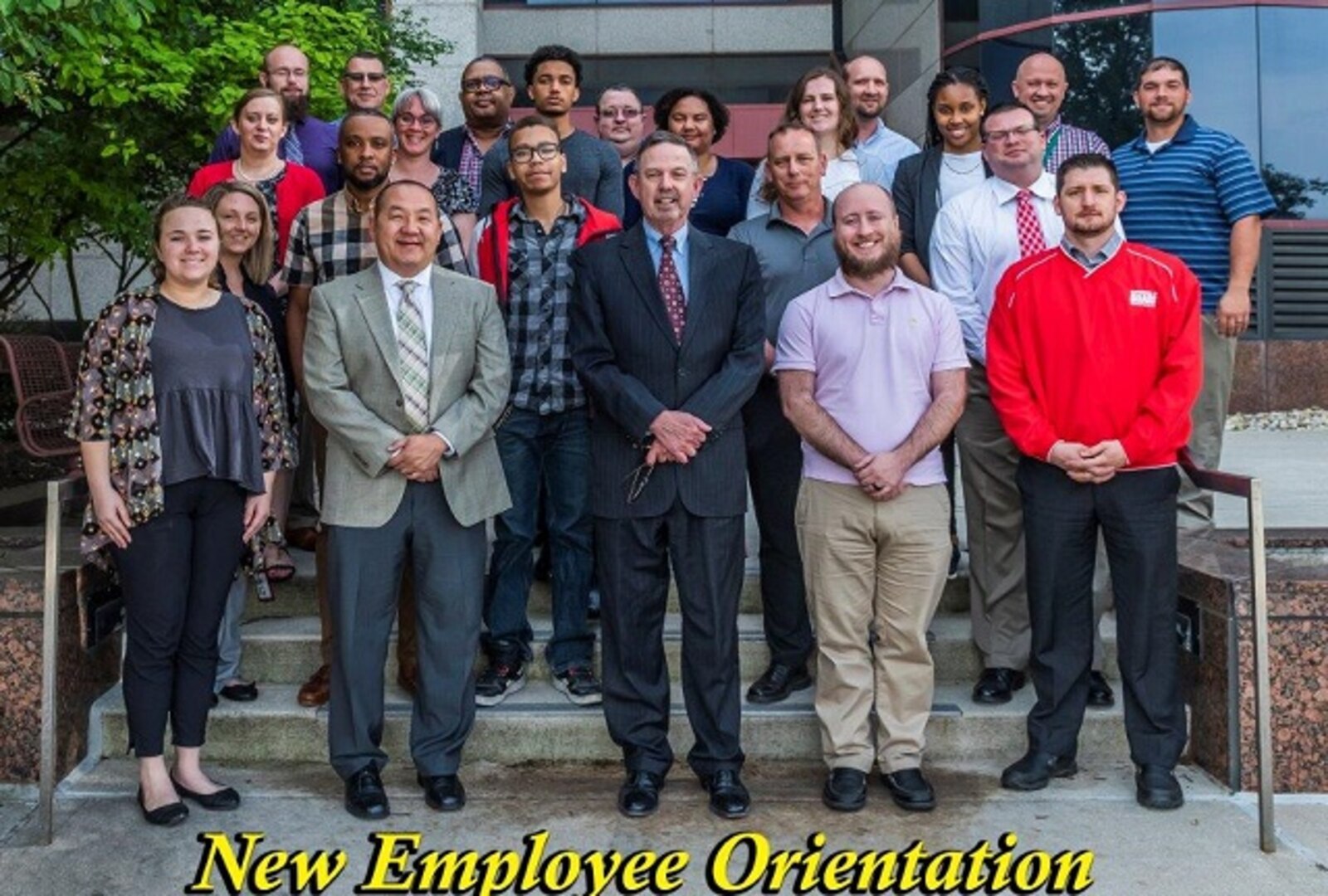 Group photo of 22 new employees with Mr. Warren for the May 2019 NEO.