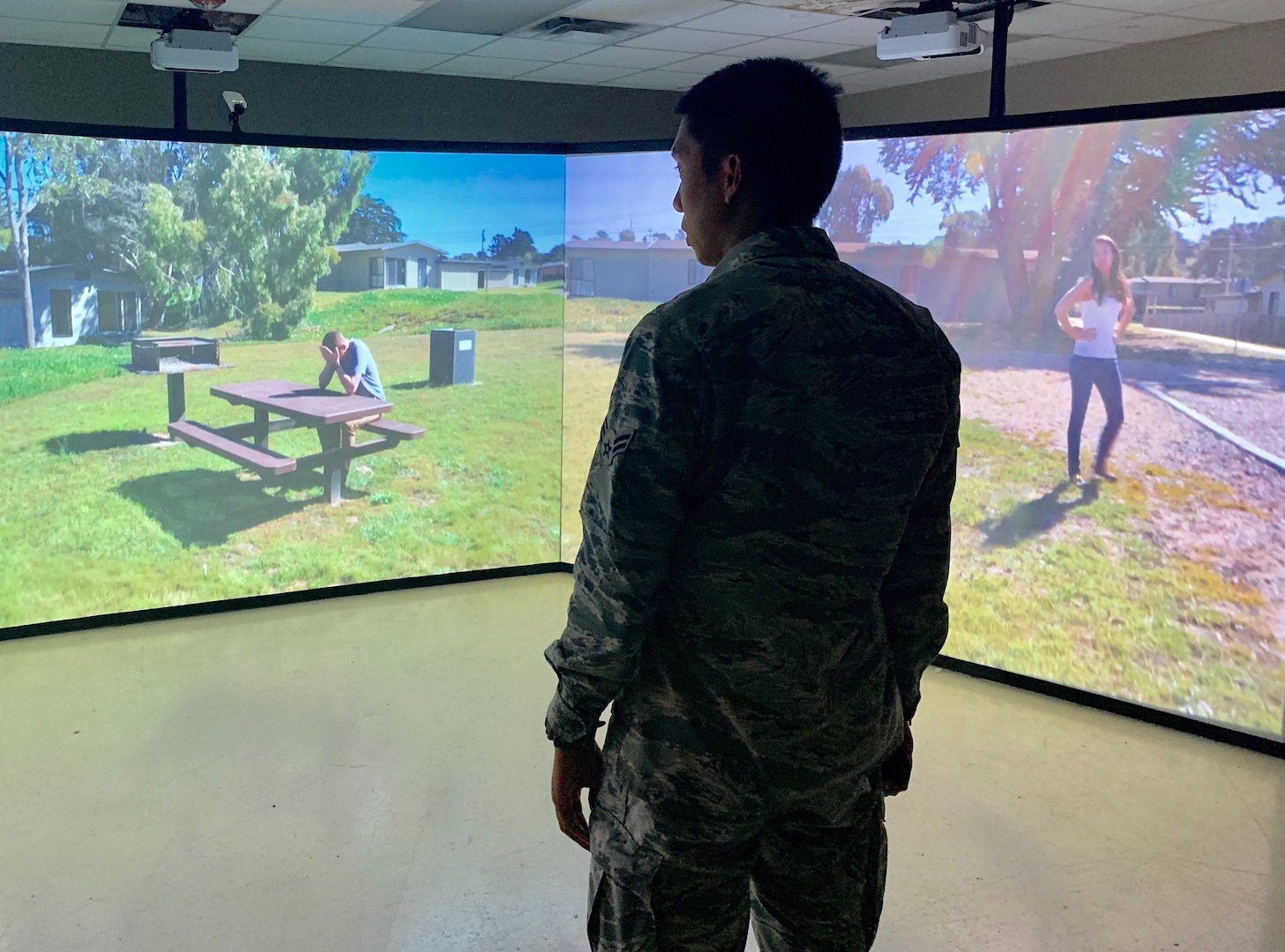 Airman 1st Class Valric Suyom, a recent graduate of the Security Forces apprentice course, participates in a use of force training scenario in the Multiple Interactive Learning Objectives, or MILO, simulator at Joint Base San Antonio-Lackland May 29. The 343rd Training Squadron has six MILO systems in place at the JBSA-Lackland Medina Annex training campus, including two 180-degree video theater systems, as well as four single-screen systems.