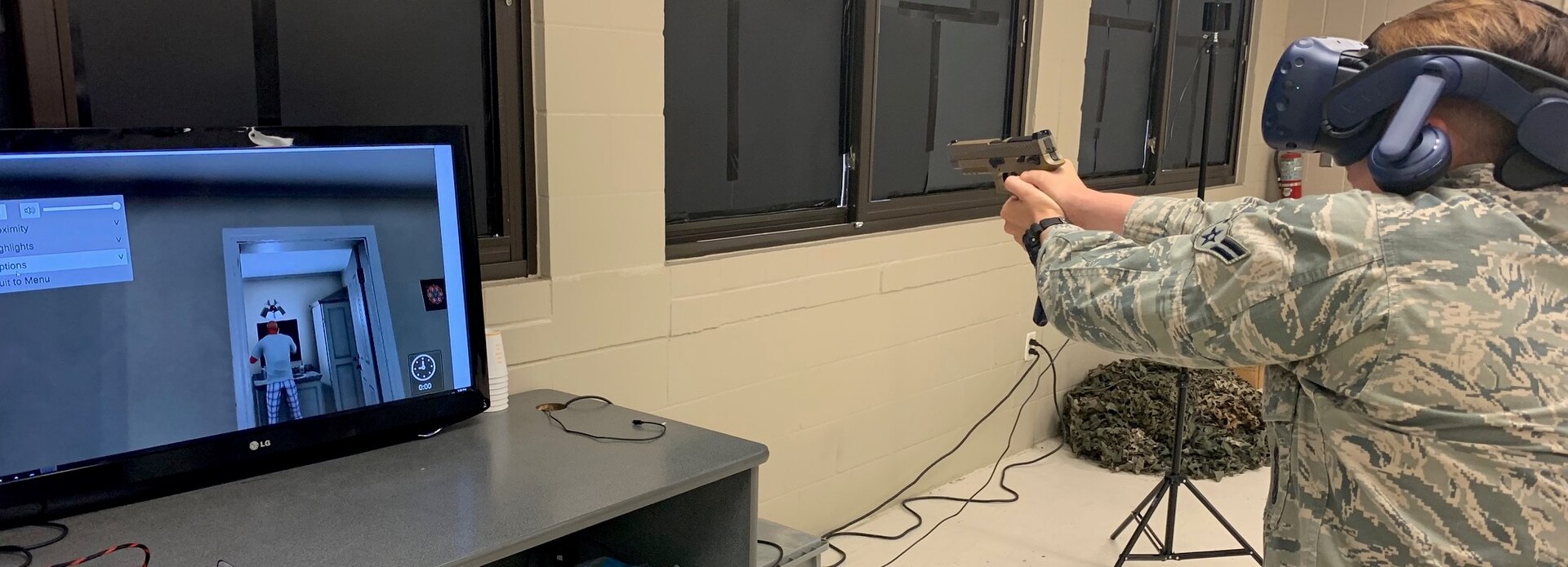 Airman 1st Class Taylor Waldron, a recent graduate of the Security Forces apprentice course, participates in a use of force training scenario in a virtual reality environment simulator at Joint Base San Antonio-Lackland May 29. The 343rd Training Squadron has added the VR training simulators as part of a beta-test in conjunction with a civilian vendor at no cost to the unit through a partnership with AFWERX.