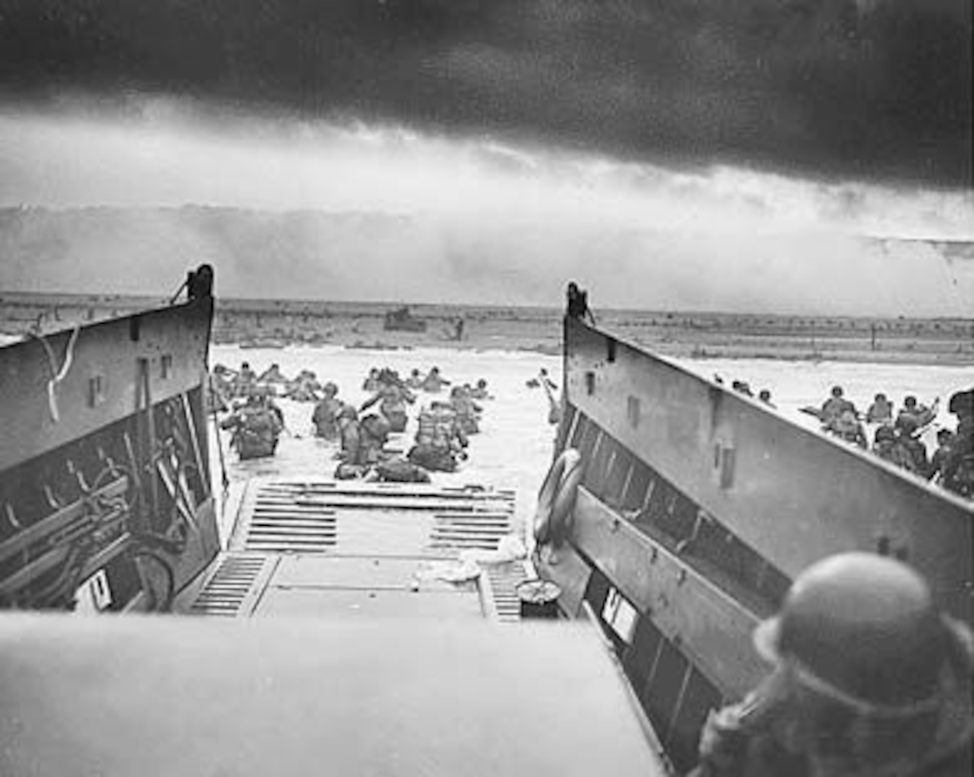 Into the Jaws of Death - U.S. Troops wading through water and Nazi gunfire (June 6, 1944).