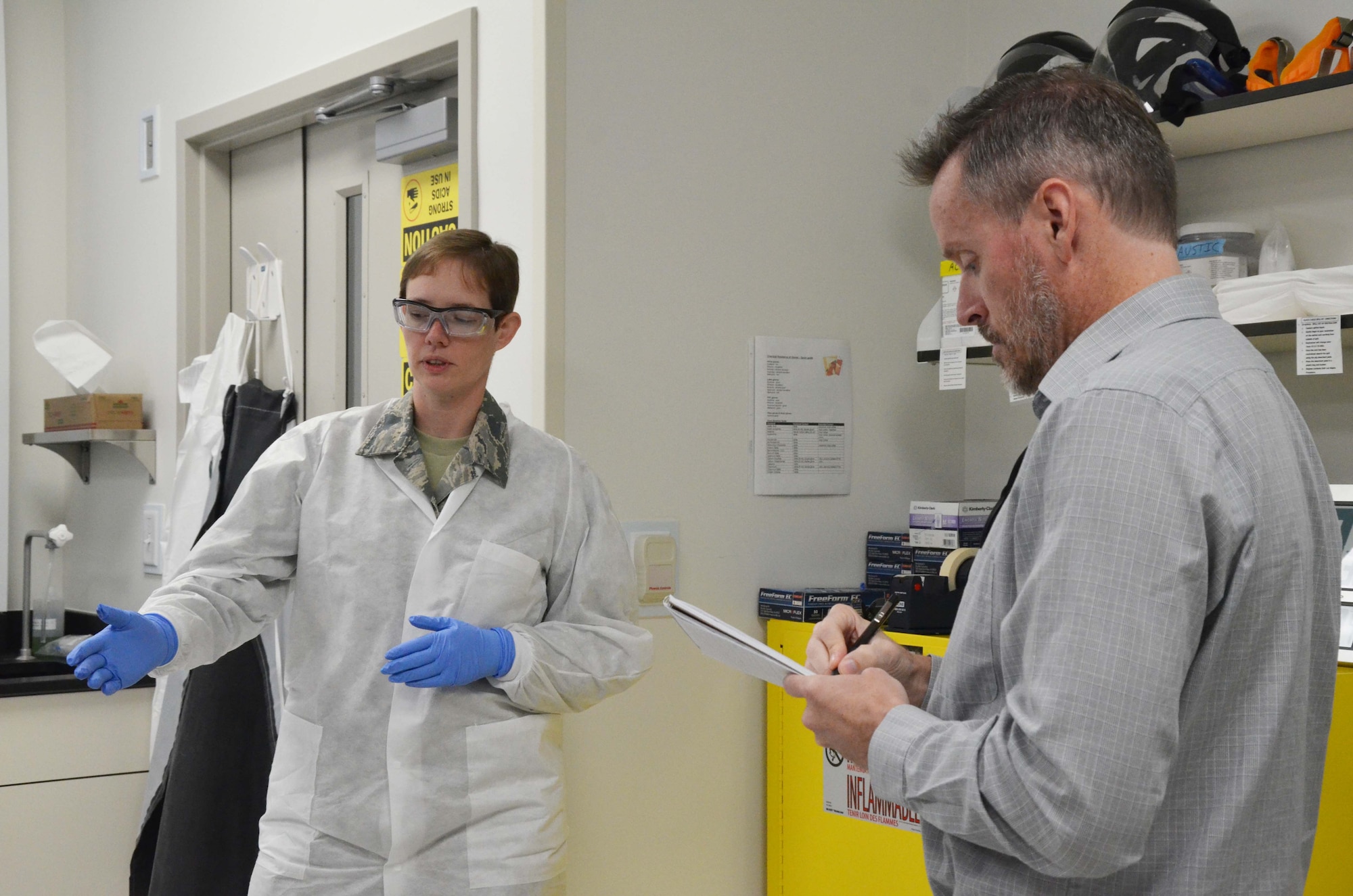 Florida Today reporter Rick Neale (right) interviews then-Airman 1st Class Cynthia A. Schroll, a radiochemistry technician with the Air Force Technical Applications Center, Patrick AFB, Fla.  Schroll was recently commissioned as a second lieutenant through the Air Force Officer Training School program.  (U.S. Air Force photo by Susan A. Romano)