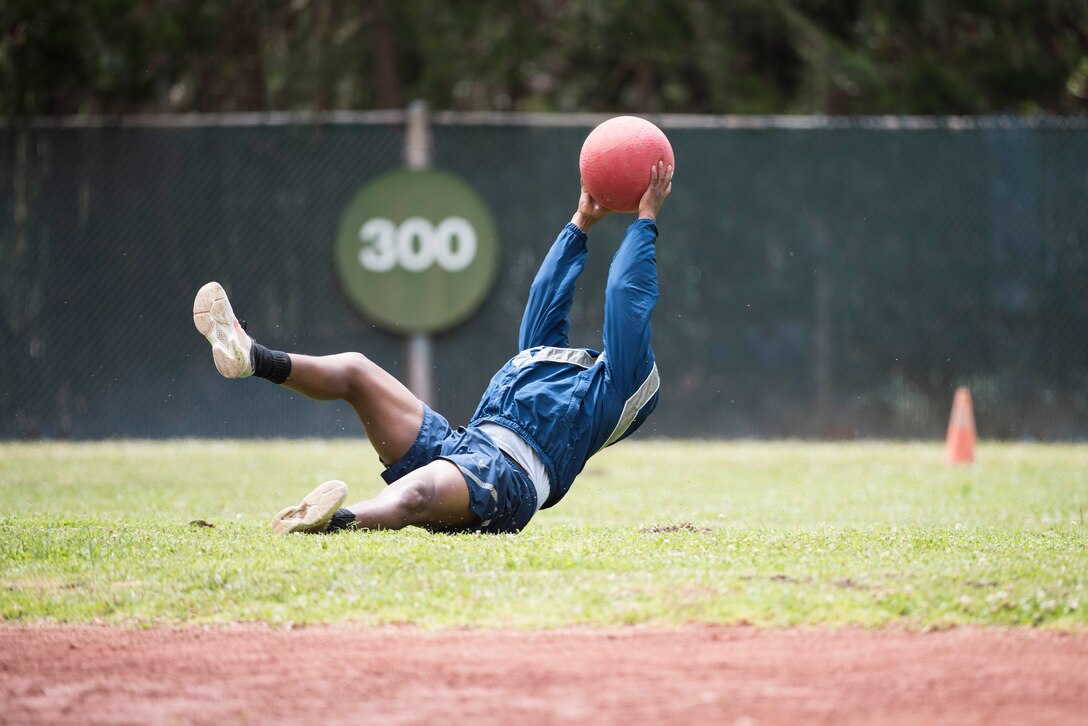 A service member catches a ball during the Spring Wingman Day kickball tournament May 23, 2019, at Vandenberg Air Force Base, Calif. Wingman Day brought together members of the 30th Space Wing as they form teams to compete in different sports including basketball, volleyball, kickball and corn hole. (U.S. Air Force photo by Airman 1st Class Hanah Abercrombie)