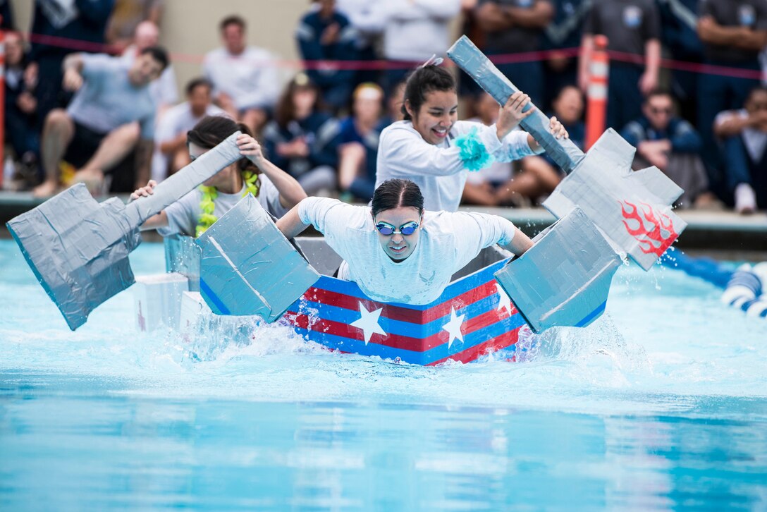 Service members participate in Vandenberg Air Force Base’s annual cardboard boat regatta during Spring Wingman Day May 23, 2019, at Vandenberg AFB, Calif. The competition rewarded winners from different categories, such as best boat design, fastest boat, and which boat could hold the most people without sinking. (U.S. Air Force photo by Airman 1st Class Hanah Abercrombie)