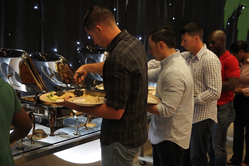 Soldiers from Area Support Group-Qatar gathered in Doha, Qatar, to celebrate iftar, the traditional Ramadan breaking of the daily fast meal. Soldiers and other service members as well as Families were invited by the Qatari armed forces International Military Cooperation Authority to attend the meal to celebrate the cooperation between the two nations.