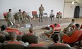 Chief Warrant Officer 2 FIRST NAME LAST NAME, a criminal investigator with Camp Buehring, Kuwait, briefs an audience of leaders from 3rd Armored Brigade Combat Team, 4th Infantry Division Sexual Harassment and Assault Reponse and Prevention (SHARP) program during leader professional development at Camp Buehring on May 23, 2019. Continuing to learn together enabled SHARP leaders to maintain the same standards across the formation and best serve victims of sexual harassment and assault.