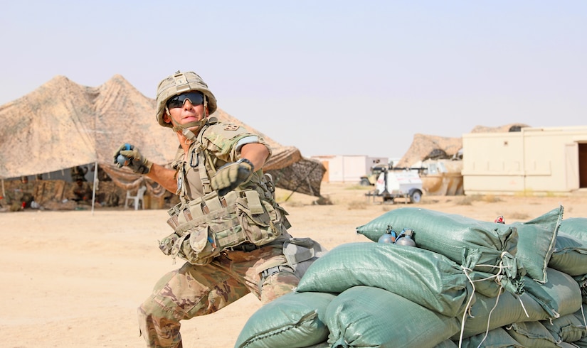 Spc. Ryan Patel, an infantry Soldier with 1st Battalion, 8th Infantry Regiment, 3rd Armored Brigade Combat Team, 4th Infantry Division, prepares to throw a practice M67 fragmentation grenade as part of Expert Infantryman Badge testing at Camp Buehring, Kuwait on Wednesday, May 29, 2019. EIB candidates were required to throw the grenade at a single enemy silhouette at a range of 35 meters, with the grenade exploding within a five-meter radius in order to receive a “go.”