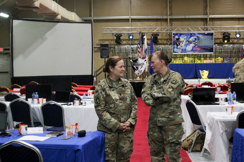 Command Sgt. Maj. Sheryl Lyon, U.S. Army Cyber Command senior enlisted leader, and Brig. Gen. Nikki Griffin Olive, commanding general of the 335th Signal Command (Theatre) (Provisional) and U.S. Army Central (USARCENT) G-6, discuss USARCENT's 2019 Best Cyber Warrior Competition, at Camp Arifjan, Kuwait, May 16, 2019. The event was the first joint, multinational competition, and highlighted the need for commanders in all services and components to prioritize the defense the networks that underpin all military operations as they do any operational key terrain.