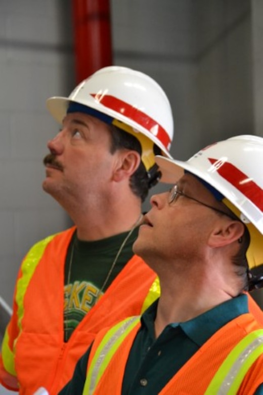 Middle East District fire protection engineers Dave Miller and Gregory Michaels, prepare for a foam extinguishing test at aircraft hangar at March Air Base. Both team members are part of the Fire Protection Technical Center of Expertise, housed at the Transatlantic Middle East District.